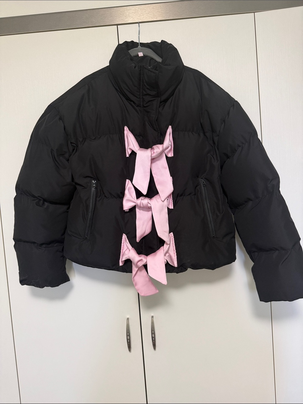 Women’s Black Cropped Puffer Jacket with Pink Bow Accents